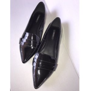 Penny loafer style flats.